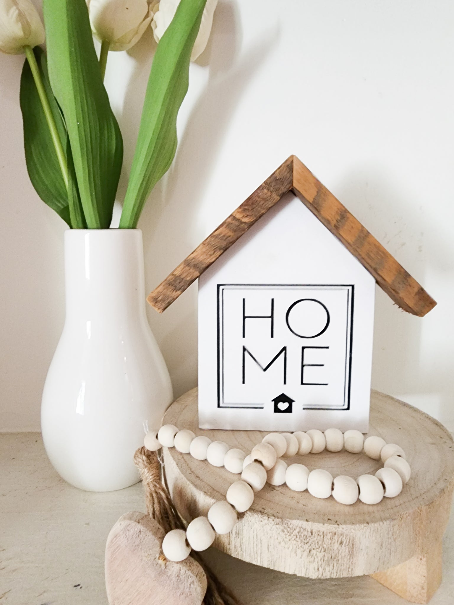 Small rustic house square "HOME" sign. White