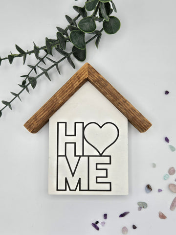 Small rustic house "Heart Home " sign.