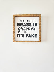 9x9 Sometimes grass is greener because its fake sign.