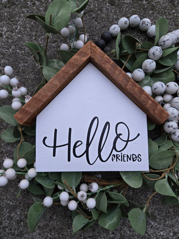 Large house "Hello Friends" sign